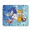 Custom Sonic and Tails gaming mousepad on a wooden desk with a computer mouse and keyboard.