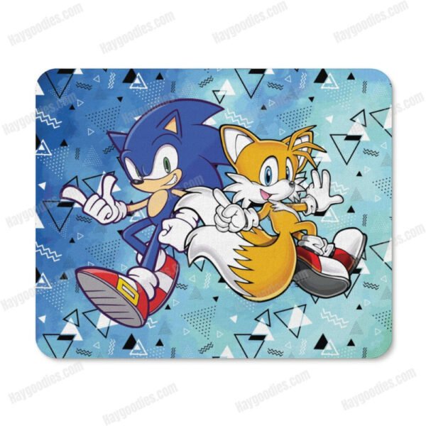 Custom Sonic and Tails gaming mousepad on a wooden desk with a computer mouse and keyboard.