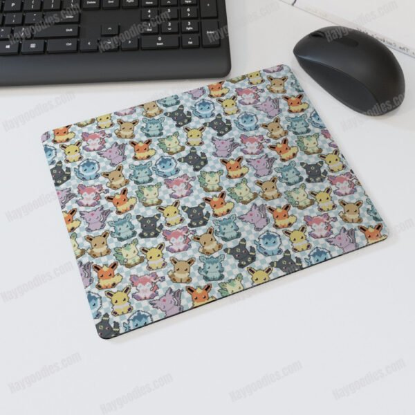 8-bit pixel art Eevee Evolution mousepad on a desk with a computer keyboard and mouse. Non-slip, 25cm x 20cm size.